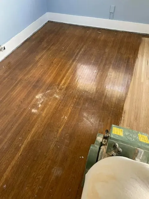 Hardwood floor refinishing completed in an open-plan Rochester NY home