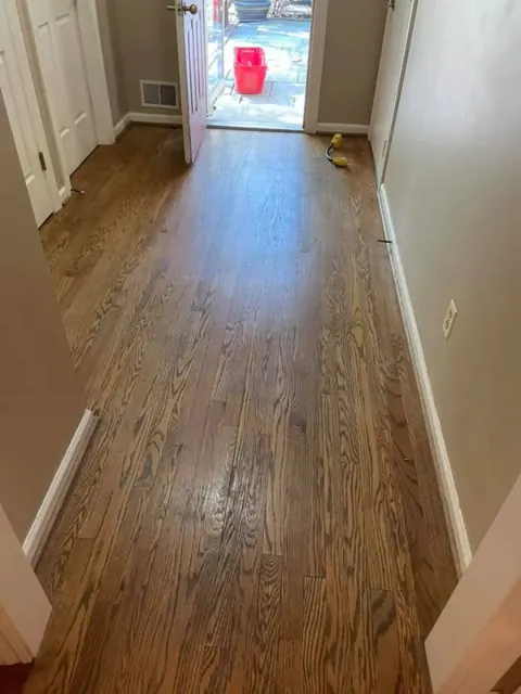 Sanded and refinished hardwood floors ready for staining by Monroe Floor Resurfacing