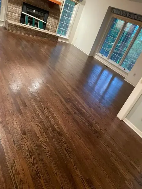 Professionally refinished hardwood floors with a smooth, even finish