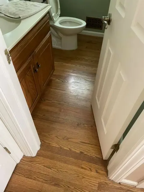 Finished hardwood floor installation with consistent board spacing and stain color
