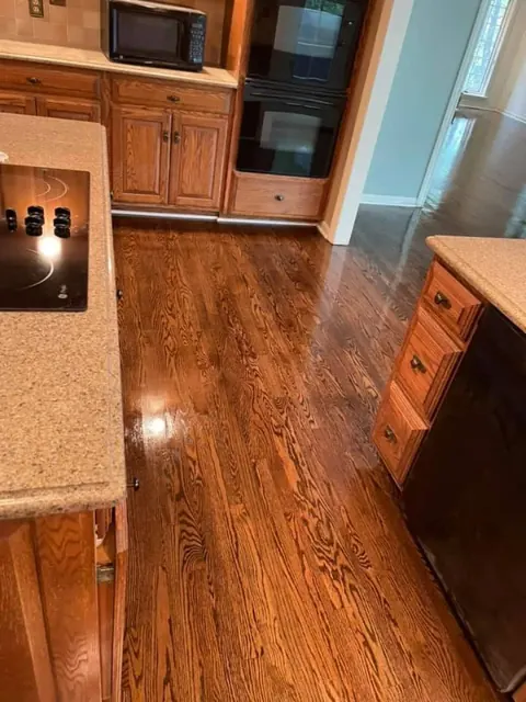 Dark stained hardwood floors installed in a residential kitchen