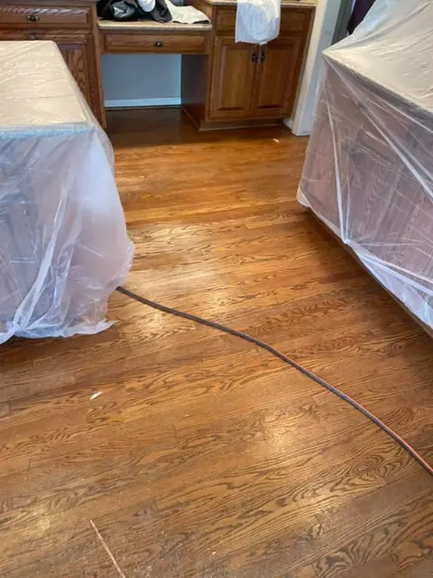 Warm-toned hardwood floors installed in a residential room near Rochester NY