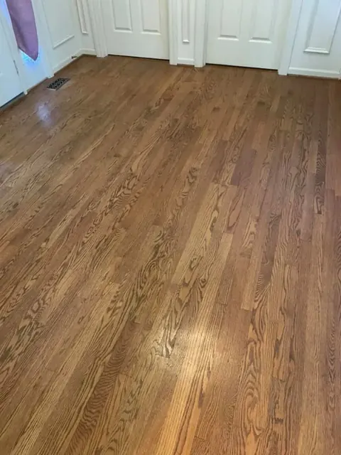 Completed light natural hardwood floor installation in a Rochester NY home