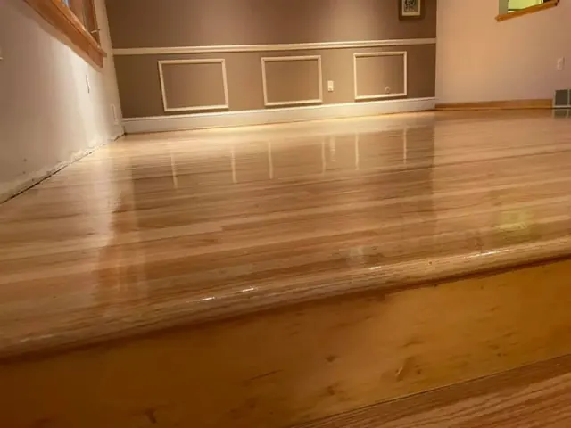 Wide-angle view of hardwood floor installation covering an entire room