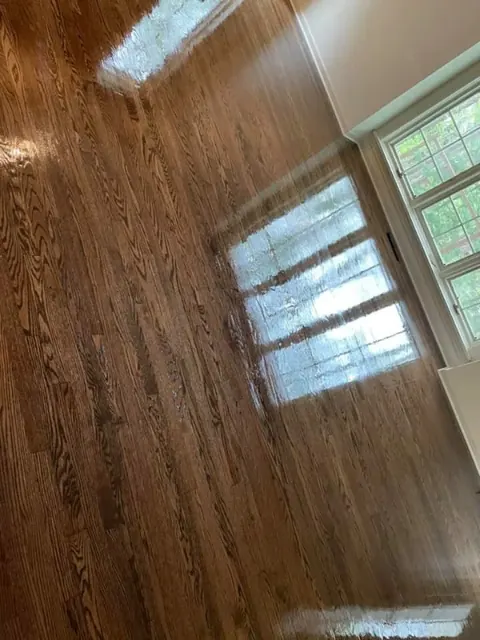 Dark hardwood floor refinishing project completed near Rochester NY