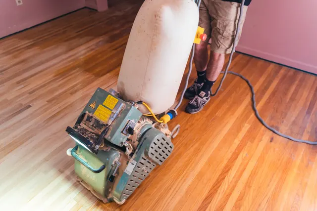 Hardwood floor refinishing work in progress in a Rochester NY residential property