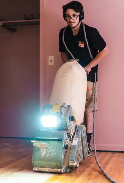 Hardwood floor refinishing with medium-brown stain in a Western New York home