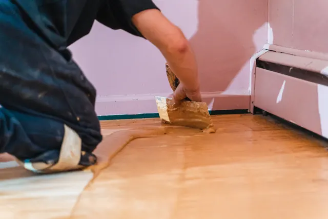 Hardwood floor boards being laid during a Monroe Floor Resurfacing installation