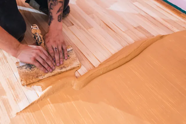 Close-up of hardwood floor planks with a smooth finish after professional resurfacing