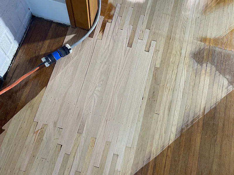 Harwood floor repaired boards during restoration project